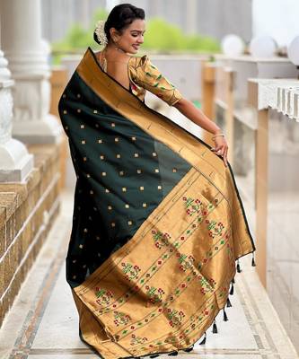 Green elegant art silk woven saree with rich zari border 2