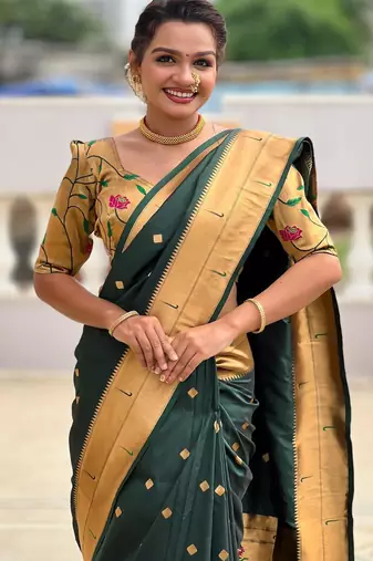 Green elegant art silk woven saree with rich zari border