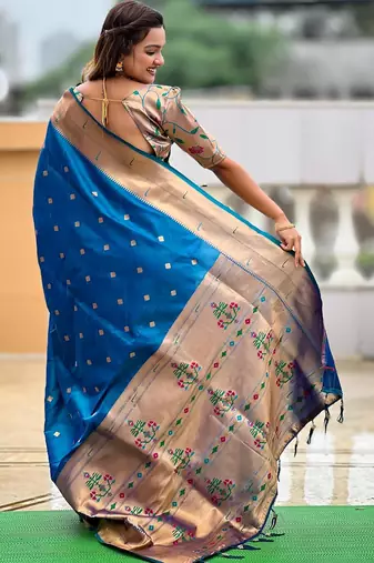 Turquoise elegant art silk woven saree with rich zari border