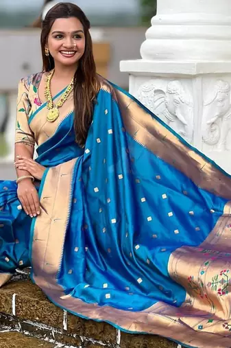 Turquoise elegant art silk woven saree with rich zari border