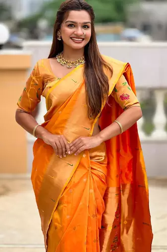 Orange elegant art silk woven saree with rich zari border