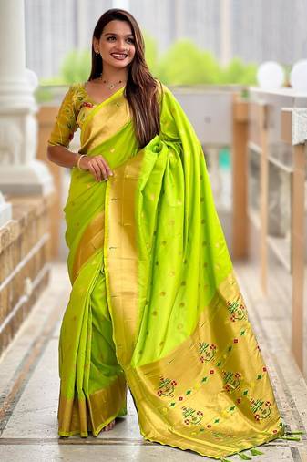 Green elegant art silk woven saree with rich zari border