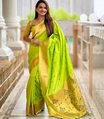 Green elegant art silk woven saree with rich zari border