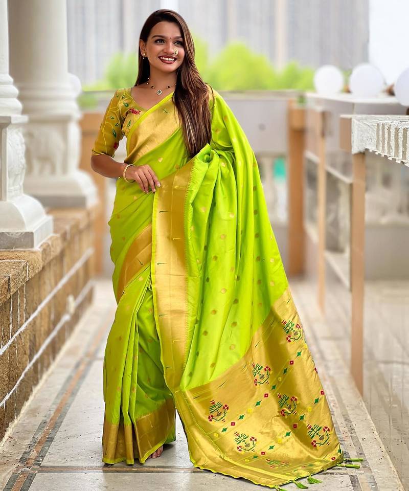 Green elegant art silk woven saree with rich zari border