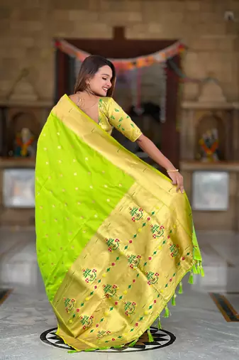 Green elegant art silk woven saree with rich zari border
