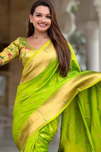 Green elegant art silk woven saree with rich zari border