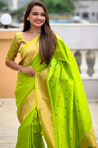 Green elegant art silk woven saree with rich zari border