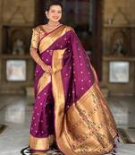 Wine elegant art silk woven saree with rich zari border