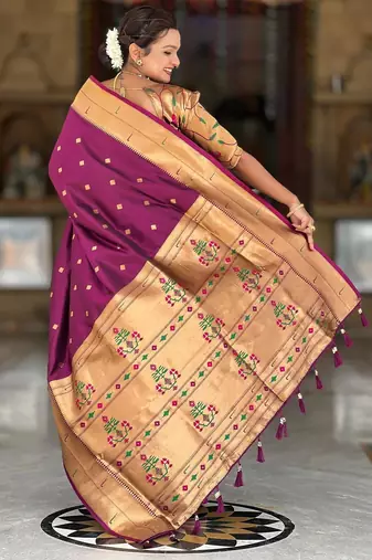 Wine elegant art silk woven saree with rich zari border