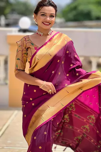 Wine elegant art silk woven saree with rich zari border