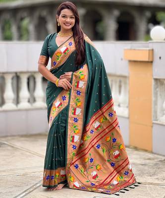 Green elegant art silk woven saree with rich zari border 1
