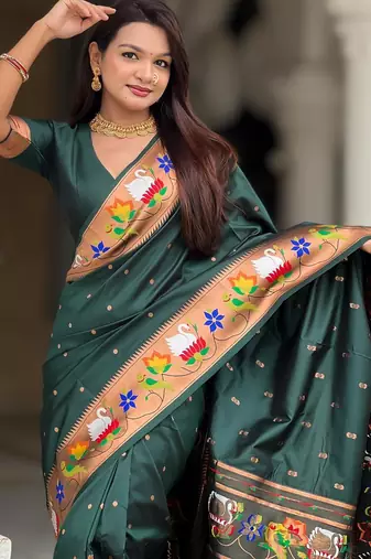 Green elegant art silk woven saree with rich zari border
