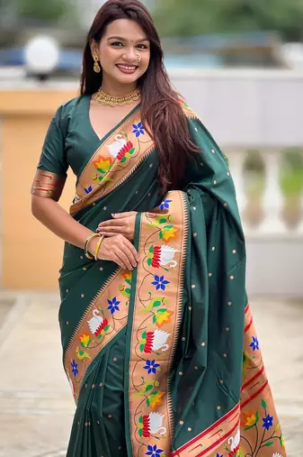 Green elegant art silk woven saree with rich zari border