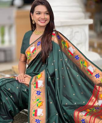 Green elegant art silk woven saree with rich zari border 5