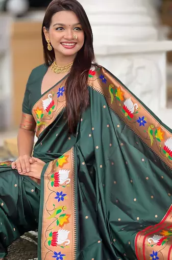 Green elegant art silk woven saree with rich zari border