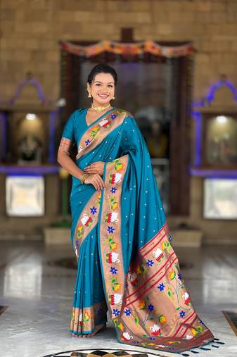 Turquoise elegant art silk woven saree with rich zari border
