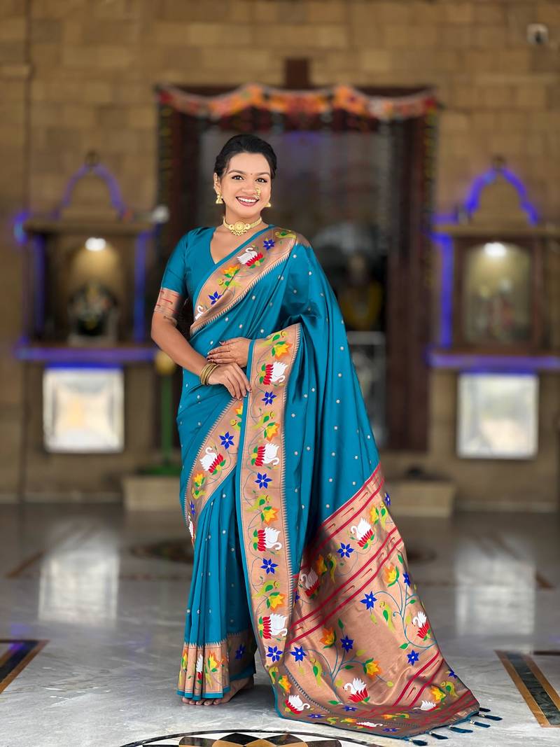 Turquoise elegant art silk woven saree with rich zari border
