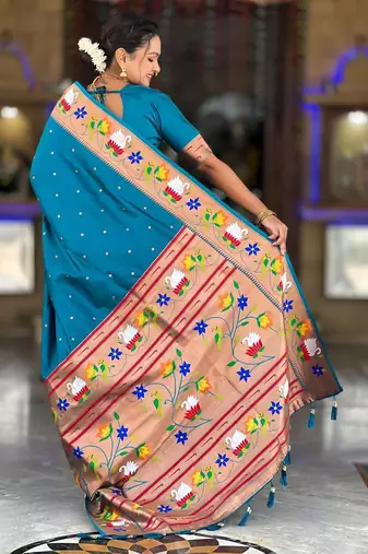 Turquoise elegant art silk woven saree with rich zari border
