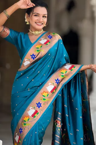 Turquoise elegant art silk woven saree with rich zari border