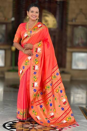 Orange elegant art silk woven saree with rich zari border