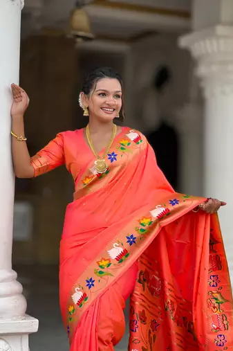 Orange elegant art silk woven saree with rich zari border