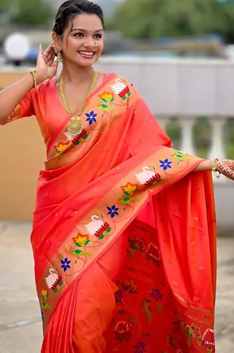 Orange elegant art silk woven saree with rich zari border