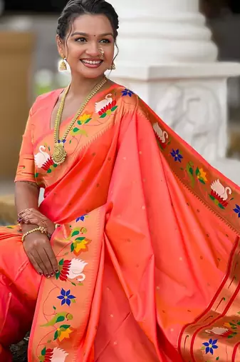 Orange elegant art silk woven saree with rich zari border