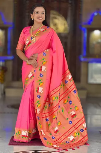 Peach elegant art silk woven saree with rich zari border