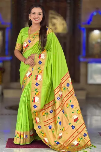 Green elegant art silk woven saree with rich zari border