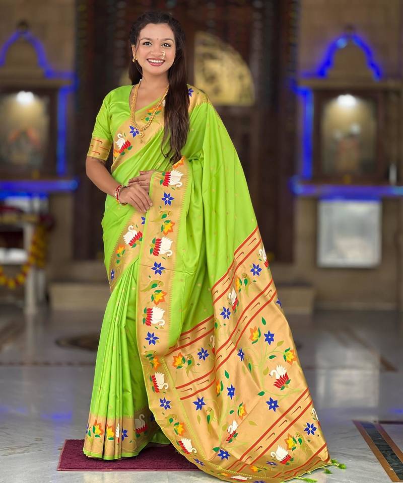 Green elegant art silk woven saree with rich zari border