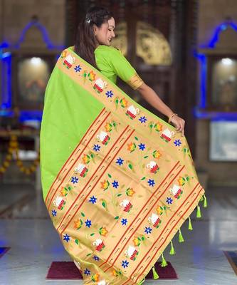 Green elegant art silk woven saree with rich zari border 2