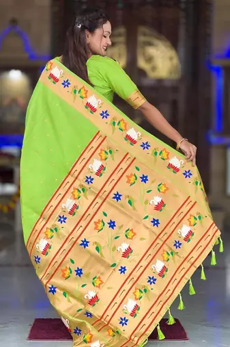 Green elegant art silk woven saree with rich zari border
