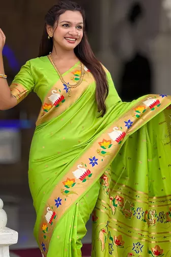 Green elegant art silk woven saree with rich zari border