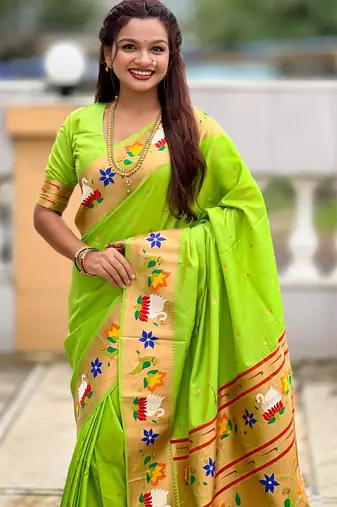 Green elegant art silk woven saree with rich zari border