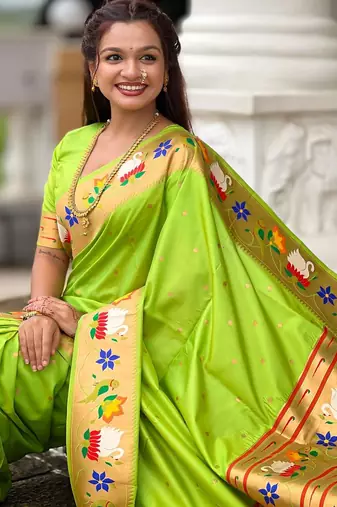 Green elegant art silk woven saree with rich zari border