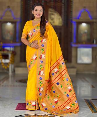 Yellow elegant art silk woven saree with rich zari border 1