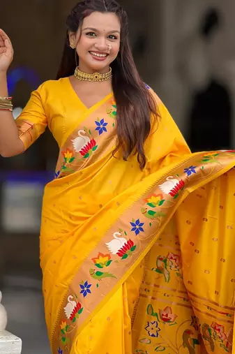 Yellow elegant art silk woven saree with rich zari border
