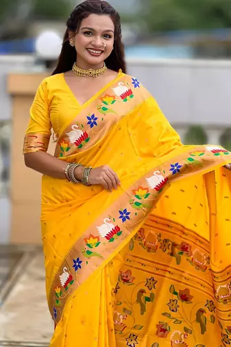 Yellow elegant art silk woven saree with rich zari border