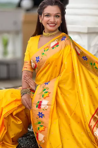 Yellow elegant art silk woven saree with rich zari border