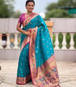Turquoise elegant art silk woven saree with rich zari border