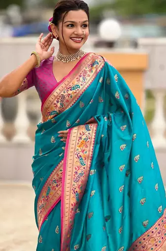 Turquoise elegant art silk woven saree with rich zari border