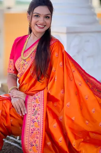 Orange elegant art silk woven saree with rich zari border