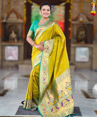 Green elegant art silk woven saree with rich zari border 1