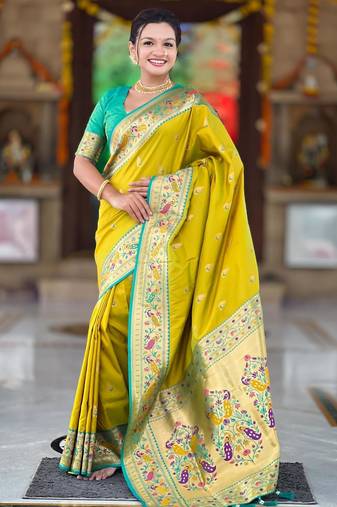 Green elegant art silk woven saree with rich zari border
