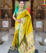 Green elegant art silk woven saree with rich zari border