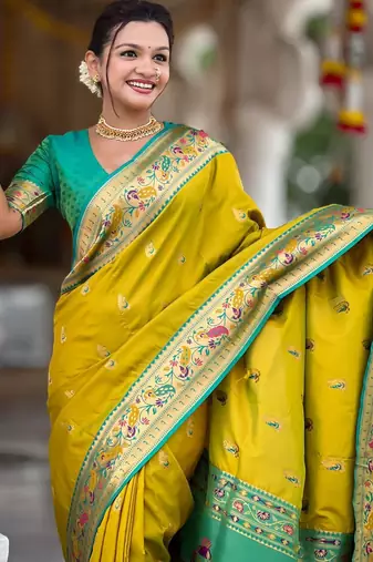 Green elegant art silk woven saree with rich zari border