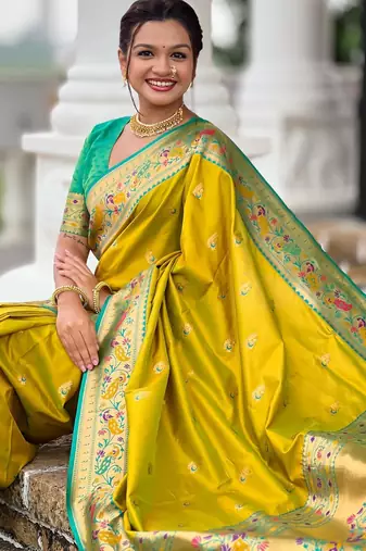 Green elegant art silk woven saree with rich zari border