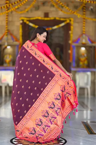 Wine elegant art silk woven saree with rich zari border