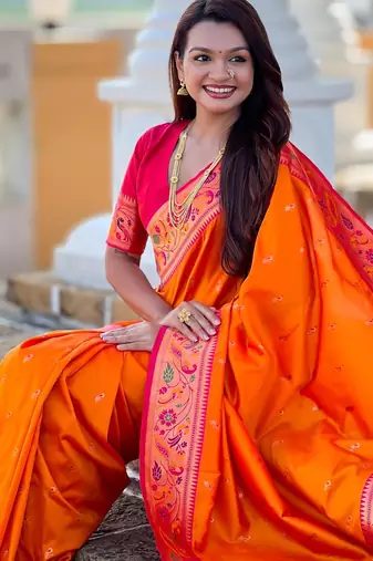 Orange elegant art silk woven saree with rich zari border