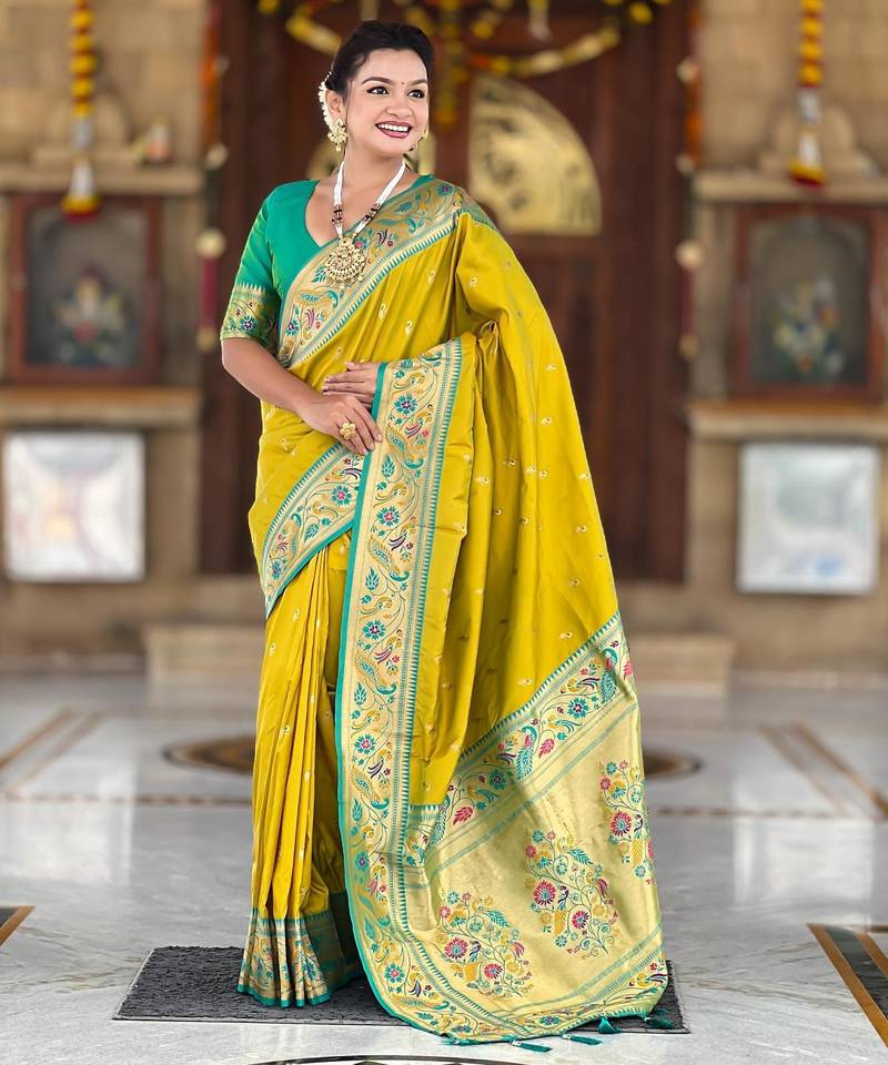 Green elegant art silk woven saree with rich zari border